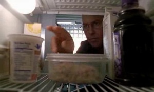 Grissom looking in the fridge